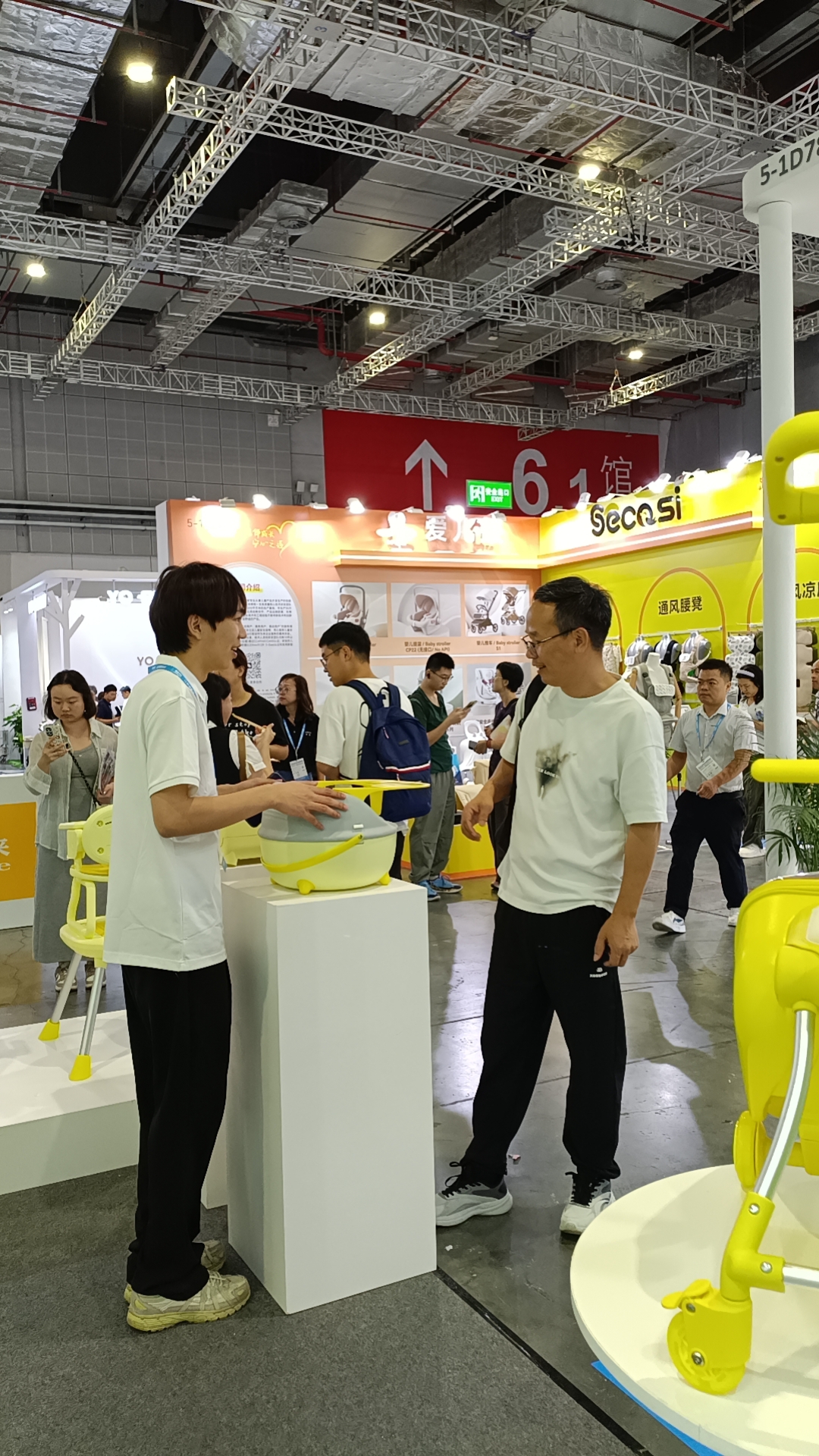 Introducing Our Compact Booster Seat to an Exhibition Visitor